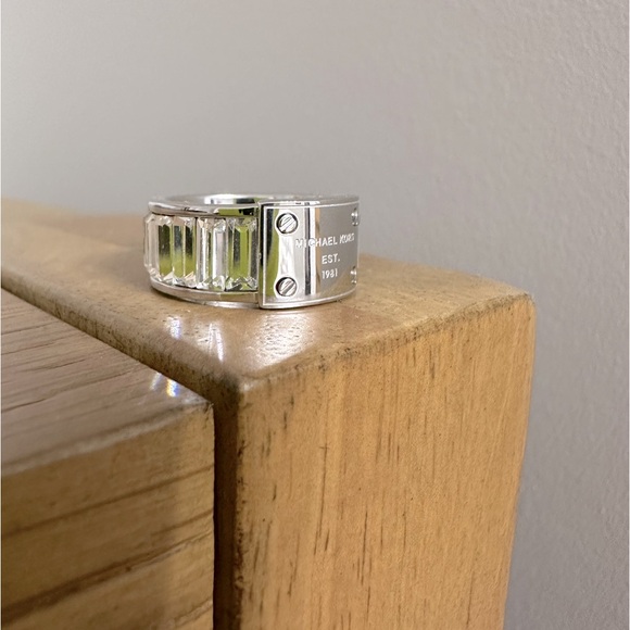 Michael Kors Jewelry - Michael Kors steel plate logo ring with Swarovski crystal band - size 8